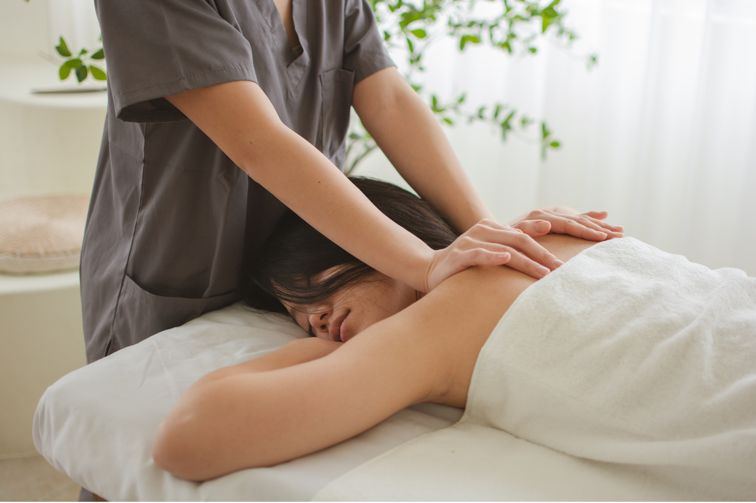 Client receiving a professional back massage from a therapist.